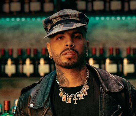 Rauw Alejandro, singer-songwriter, to see Headshot from Rauw Alejandro with a Cap